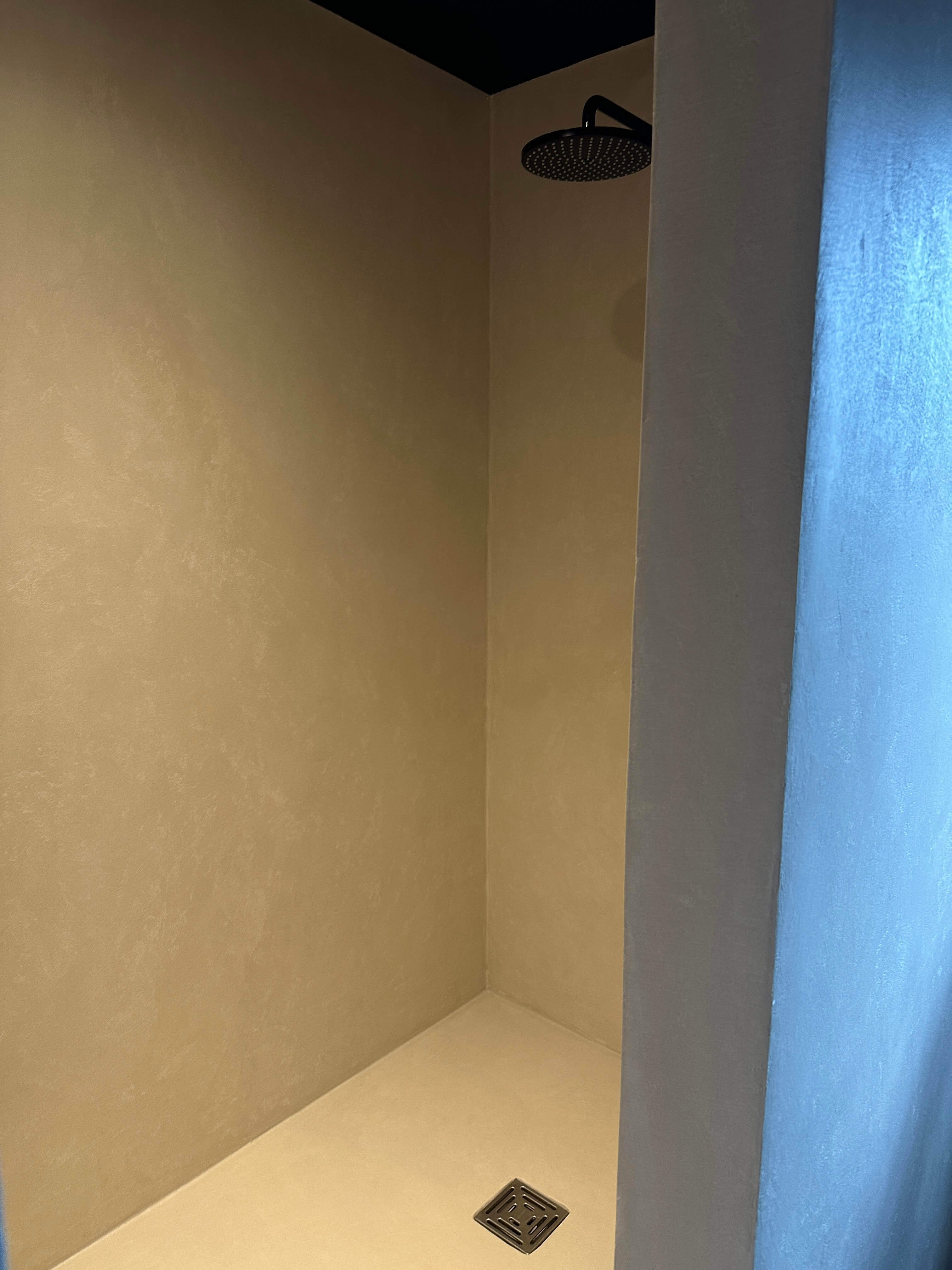 Modern bathroom shower with microcement finish
