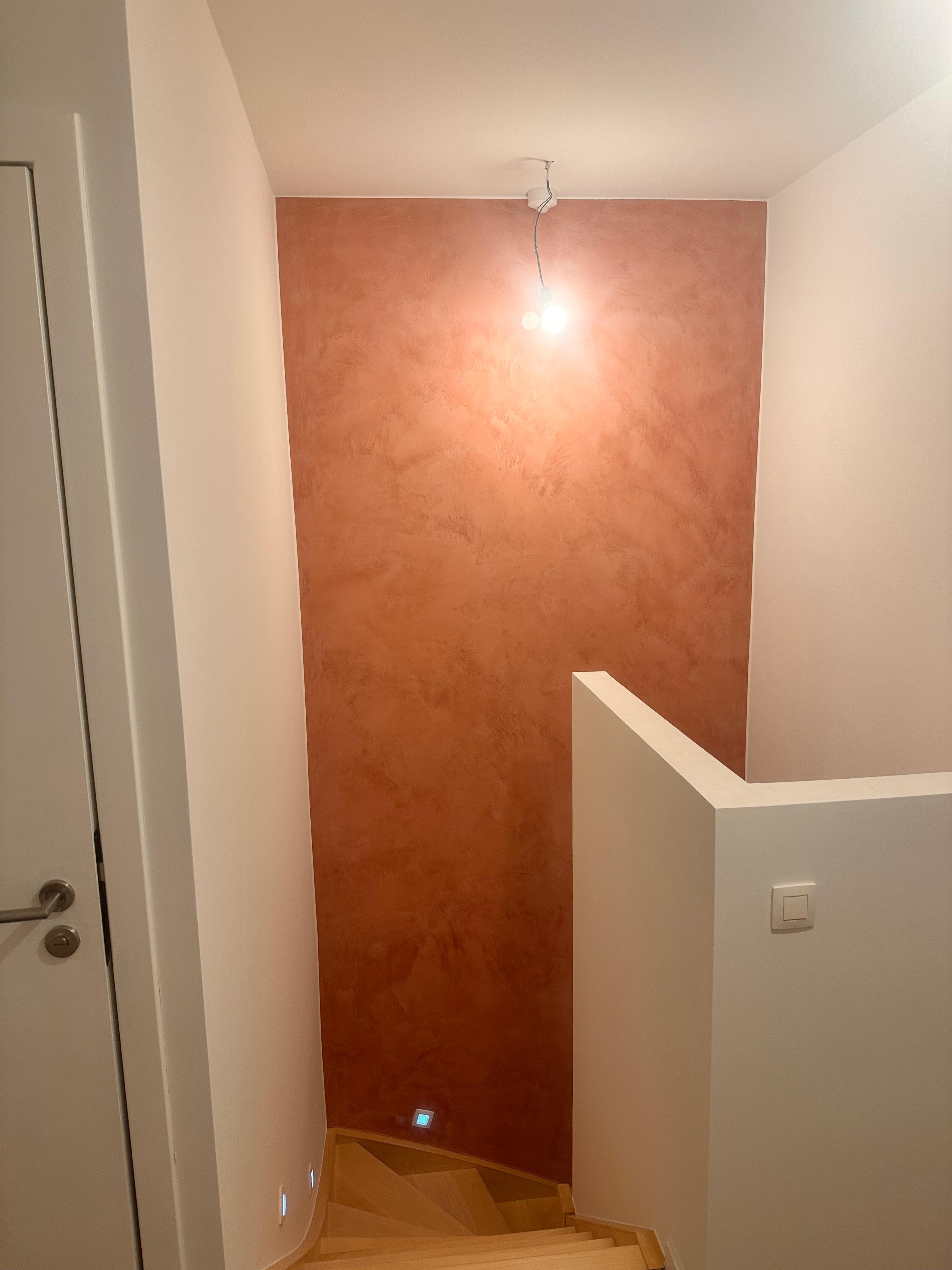 Modern trap wall with microcement and paint finish